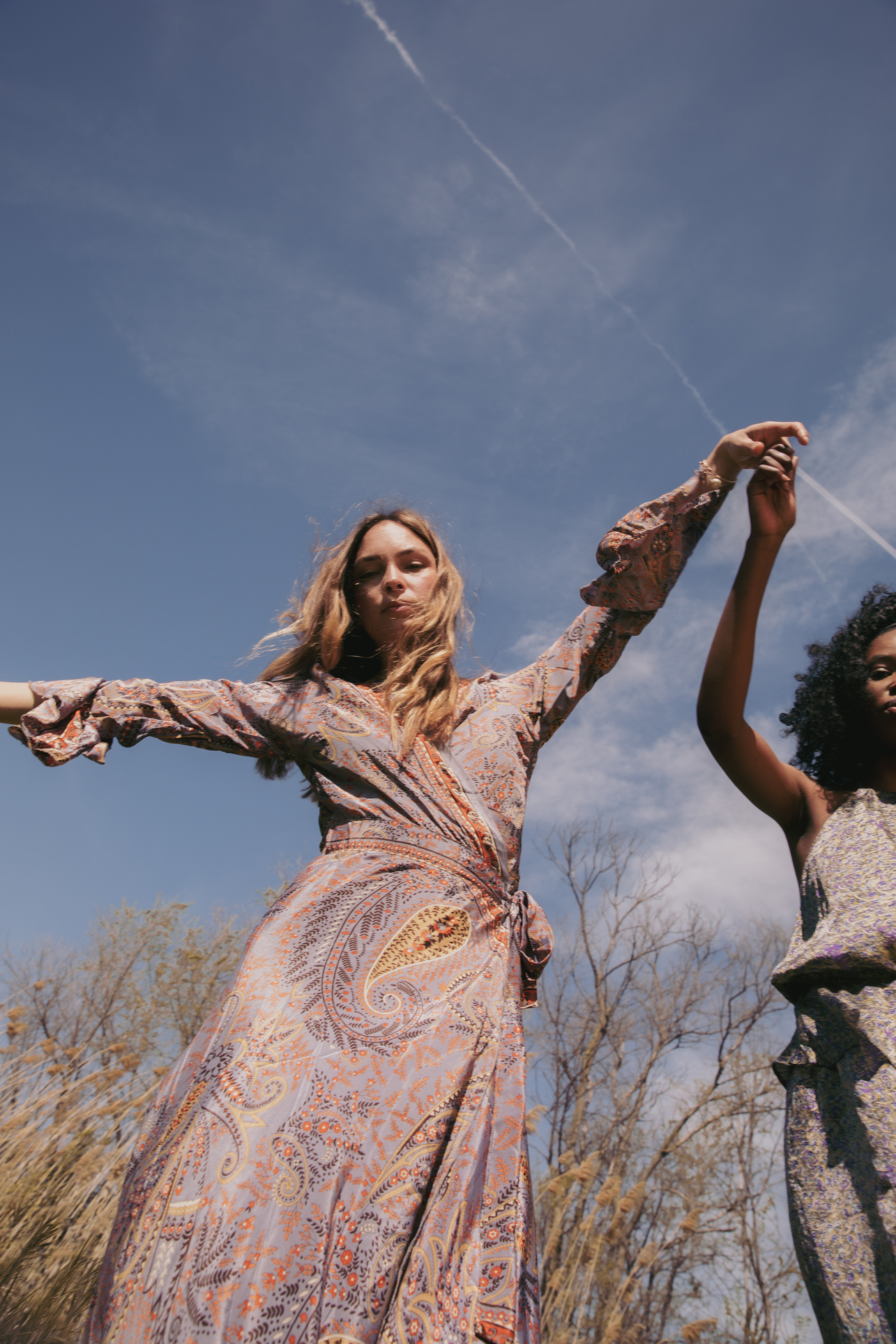 Two Diverse Women Holding Hands Outdoors